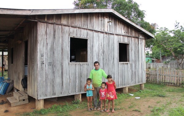 Sebastiao in front of his home