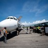 Um voo levando deportados do centro de detenção de Louisiana chega ao Aeroporto Internacional de Toussaint Louverture em Porto Príncipe em 13 de Setembro de 2011. (Foto: Jacob Kushner/FCIR)